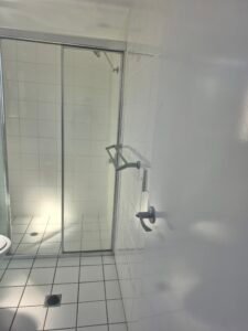 Clean glass shower screen and tapware