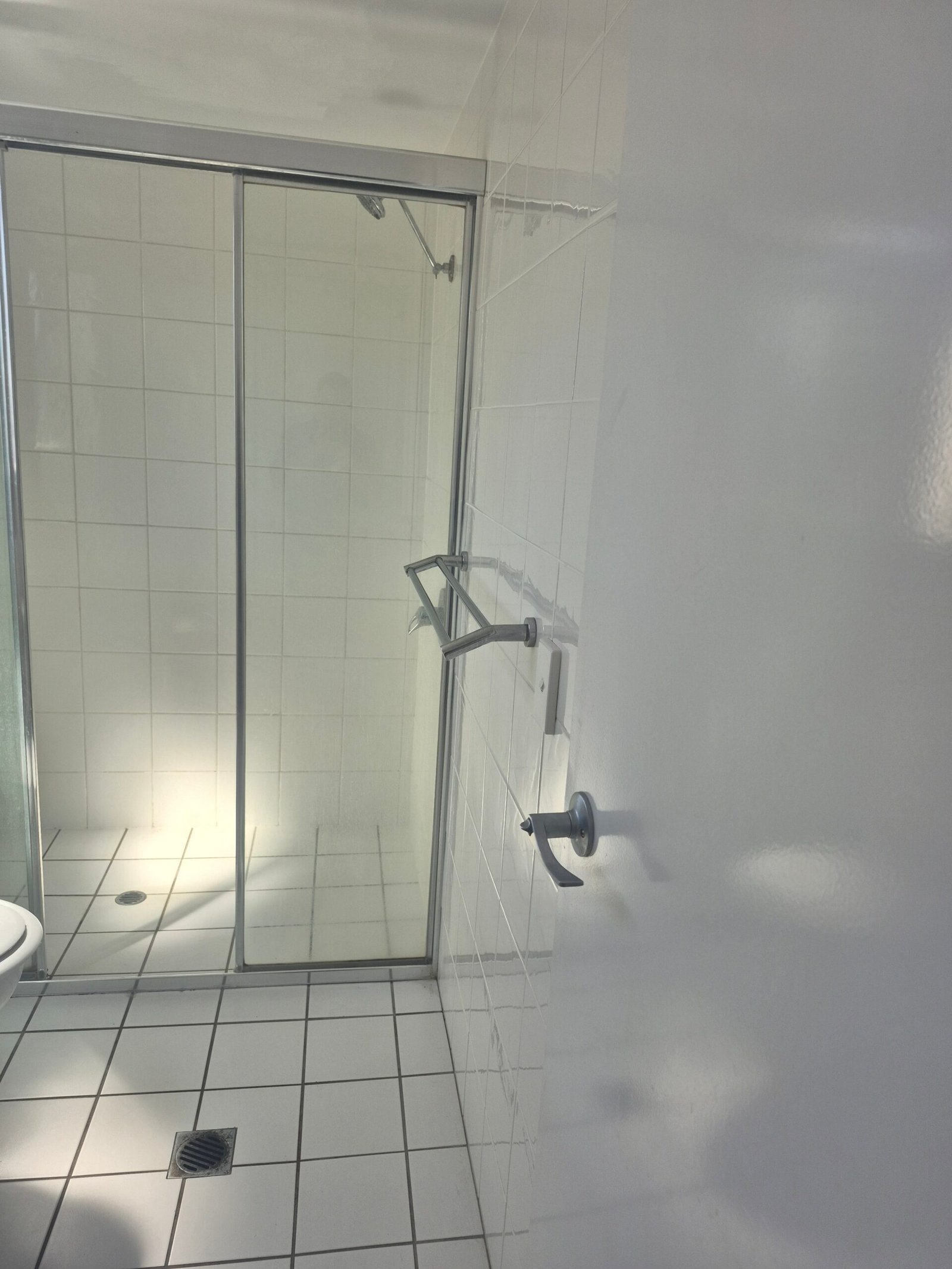 Clean glass shower screen and tapware