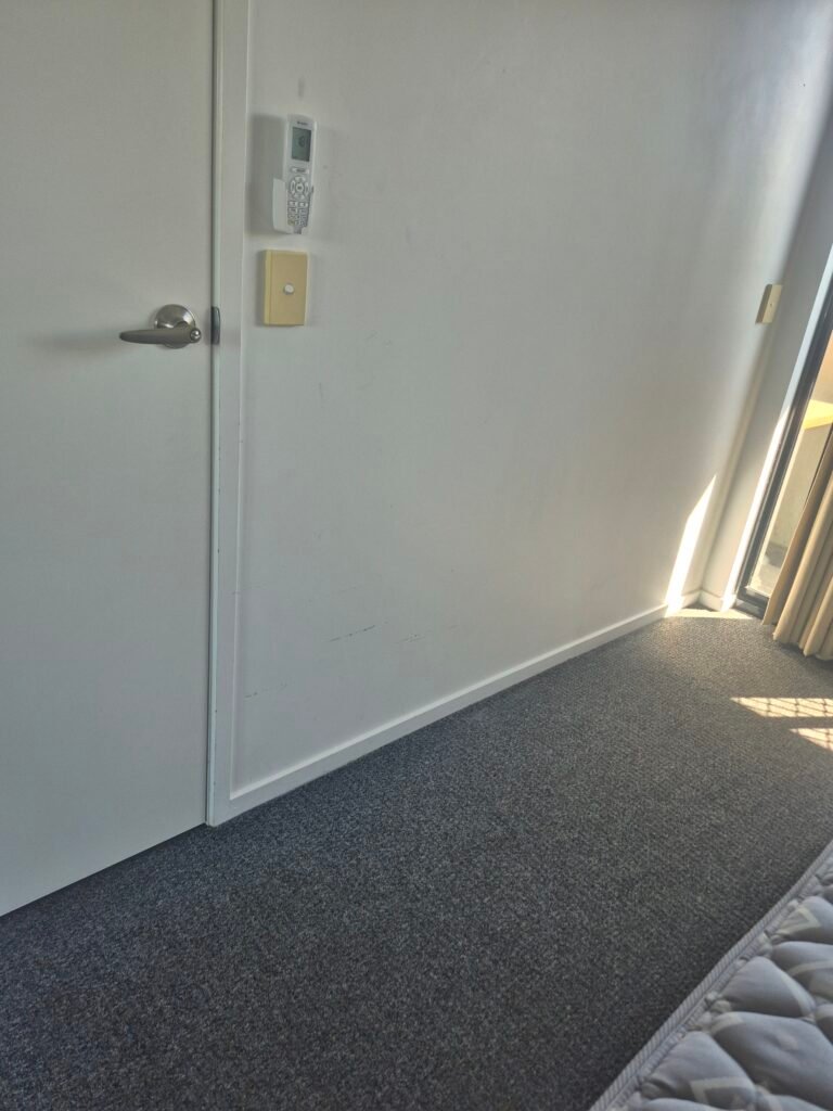 Clean bedroom carpet and doorway