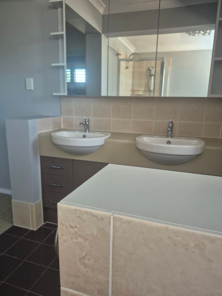 Bathroom vanity, mirror and tiles cleaned