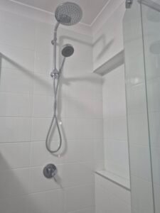 Bathroom showerhead and tiles cleaned