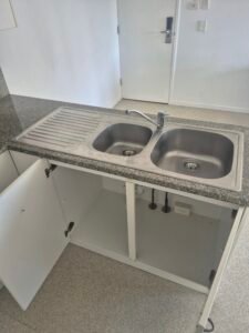 Kitchen sink and cabinets cleaned
